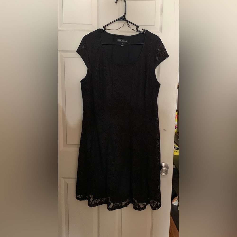 Karin Stevens black lace overlay dress.